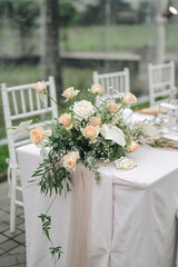 romantic wedding decoration. Outdoors with clear tent. Modern wedding ceremony or reception for family and friends dinner. Intimacy event. orange Soft colors flowers