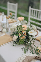 romantic wedding decoration. Outdoors with clear tent. Modern wedding ceremony or reception for family and friends dinner. Intimacy event. orange Soft colors flowers