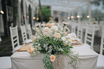 romantic wedding decoration. Outdoors with clear tent. Modern wedding ceremony or reception for family and friends dinner. Intimacy event. orange Soft colors flowers