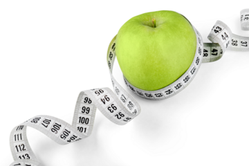 Body Measuring Tape Around A Green Apple