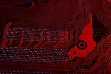 Computer cpu processor chip on circuit board ,motherboard background. Close-up. With red-blue lighting