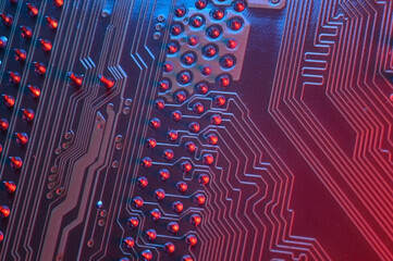 Computer cpu processor chip on circuit board ,motherboard background. Close-up. With red-blue...