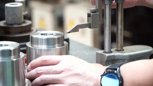 man measure part accuracy by height gauge, Tool for Inspection product in engineering lab, Caliper height gauge on surface plate
