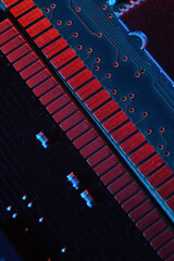 Computer cpu processor chip on circuit board ,motherboard background. Close-up. With red-blue lighting