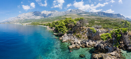 Fototapeta na wymiar Stunning landscape with rocky island and clean water on the beach,Brela,Makarska riviera,Dalmatia,Croatia,Europe