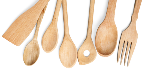 border of wooden kitchen utensils  on white background