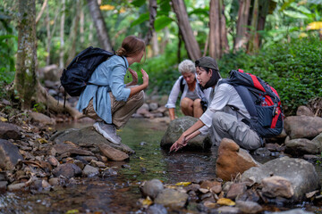 Backpack tourist travel hiking outdoor adventure use water stream from mountain washing hand