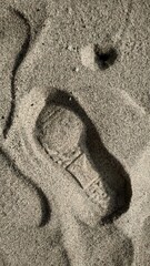 Fototapeta na wymiar footstep on the sand at menganti beach