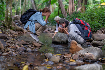 Backpack tourist travel hiking outdoor adventure use water stream from mountain washing hand