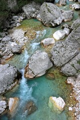 Vertical drone shot of the pure water of Soca river in Slovenia