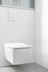 Naklejka na ściany i meble white toilet bowl in lavatory at modern apartment