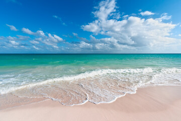 Fototapeta na wymiar Beautiful beach and waves of Caribbean Sea. Riviera Maya, Mexico