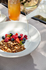 Breakfast granola with berries and yogurt.