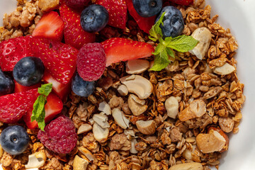 Breakfast granola with berries and yogurt.