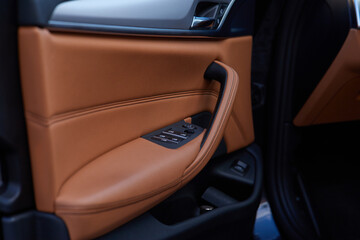 Detail of the new modern car interior. Close-up, shallow focus of the lock and switch mechanism on...