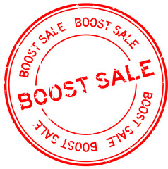 Grunge red boost sale word round rubber seal stamp on white background