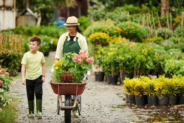 Mother and Son Working at Plant Nursery