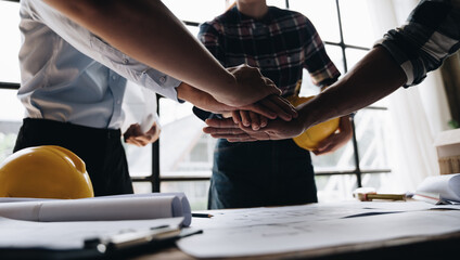 Businessman handshake with engineering in construction renovate building site. Engineer/architect inspection workplace for project.Teamwork construction engineer,business and architecture concept.