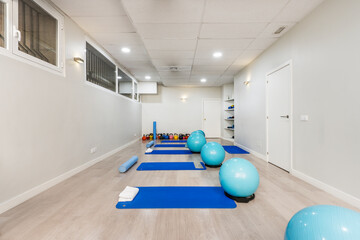 Room of a healing gym with objects and machines for this purpose in various shades of blue