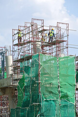 JOHOR, MALAYSIA -APRIL 13, 2016: Scaffolding used as the temporary structure to support platform, form work and structure at the construction site. Also used it as a walking platform for workers. 
