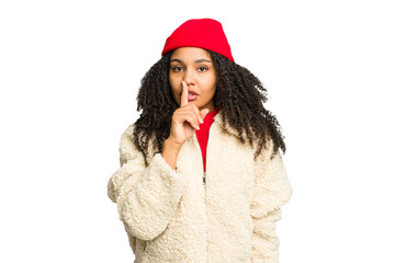 Young african american woman wearing winter clothes isolated keeping a secret or asking for silence.