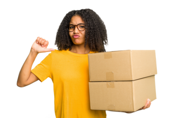 Young african american woman moving to other house while picking up a box full of things isolated feels proud and self confident, example to follow.