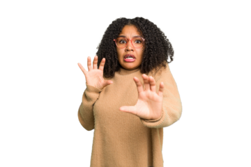 Young african american woman isolated being shocked due to an imminent danger