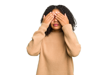 Young african american woman isolated afraid covering eyes with hands.