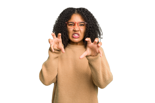 Young african american woman isolated showing claws imitating a cat, aggressive gesture.