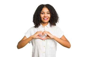 Young african american woman isolated smiling and showing a heart shape with hands.