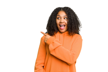 Young african american woman isolated looks aside smiling, cheerful and pleasant.