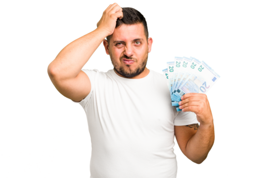 Young caucasian man holding a banknotes isolated being shocked, she has remembered important meeting.