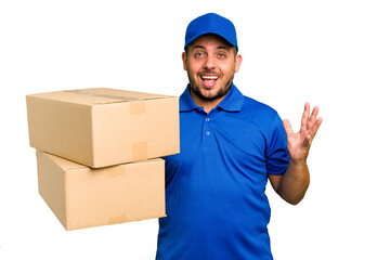 Delivery caucasian man isolated receiving a pleasant surprise, excited and raising hands.
