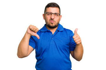 Young caucasian man isolated showing thumbs up and thumbs down, difficult choose concept