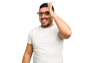 Young caucasian man isolated excited keeping ok gesture on eye.