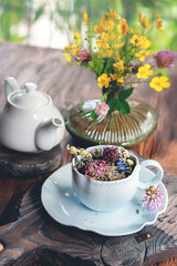 herbal tea in a blue porcelain cup. Morning still life with beautiful contrasting light