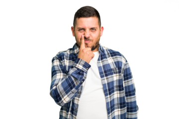 Young caucasian man isolated thinking and looking up, being reflective, contemplating, having a fantasy.