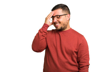 Fototapeta premium Young caucasian man isolated laughing happy, carefree, natural emotion.