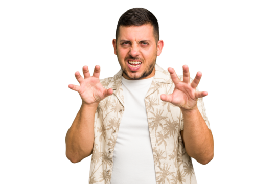 Young caucasian man isolated showing claws imitating a cat, aggressive gesture.