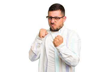 Young caucasian man isolated showing fist to camera, aggressive facial expression.