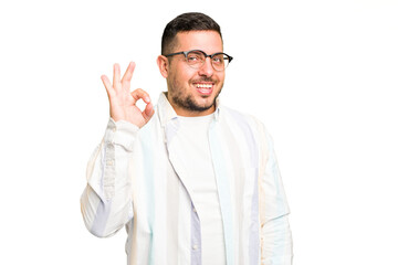 Fototapeta premium Young caucasian man isolated cheerful and confident showing ok gesture.