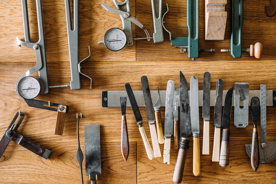 Set of various tools on wooden table in luthiery