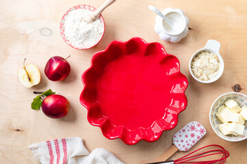 Background for making apple pie. Christmas cake, background for baking a cake with apples, ingredients for making sweet dough, on a wooden background. Copy space.