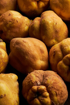 Fresh yellow lemons serving on wooden surface