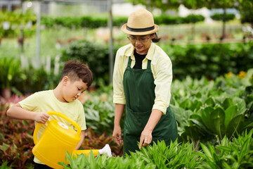 Mother and Son Watering Plants