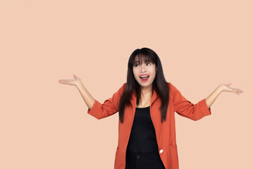 close up attractive adult business woman asian girl raise fists celebrate achievement with happy and smile against white concrete wall office with concrete background and blank copy space.