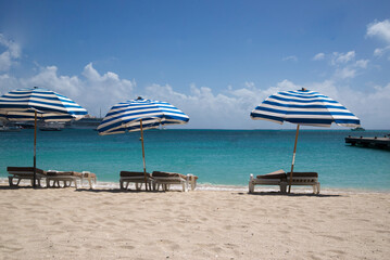 beach with umbrella in St. Maarten caribbean island