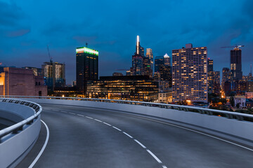 Fototapeta premium Empty urban asphalt road exterior with city buildings background. New modern highway concrete construction. Concept way to success. Transportation logistic industry fast delivery. Philadelphia. USA.