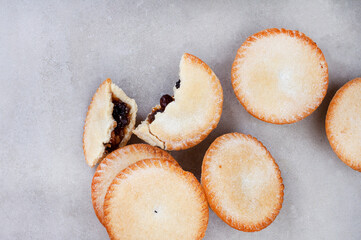 Christmas fruit mince pies on gray surface with lots of copy space