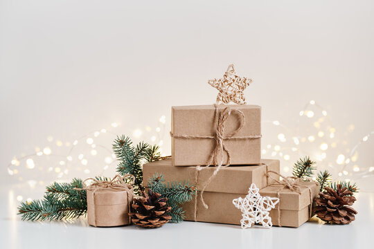 Christmas sustainable gift boxes composition with natural decor. Christmas zero waste, boxing day and winter holiday
